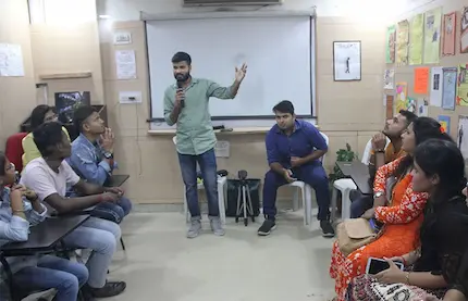 Student leads a q&a session while classmates participate with questions